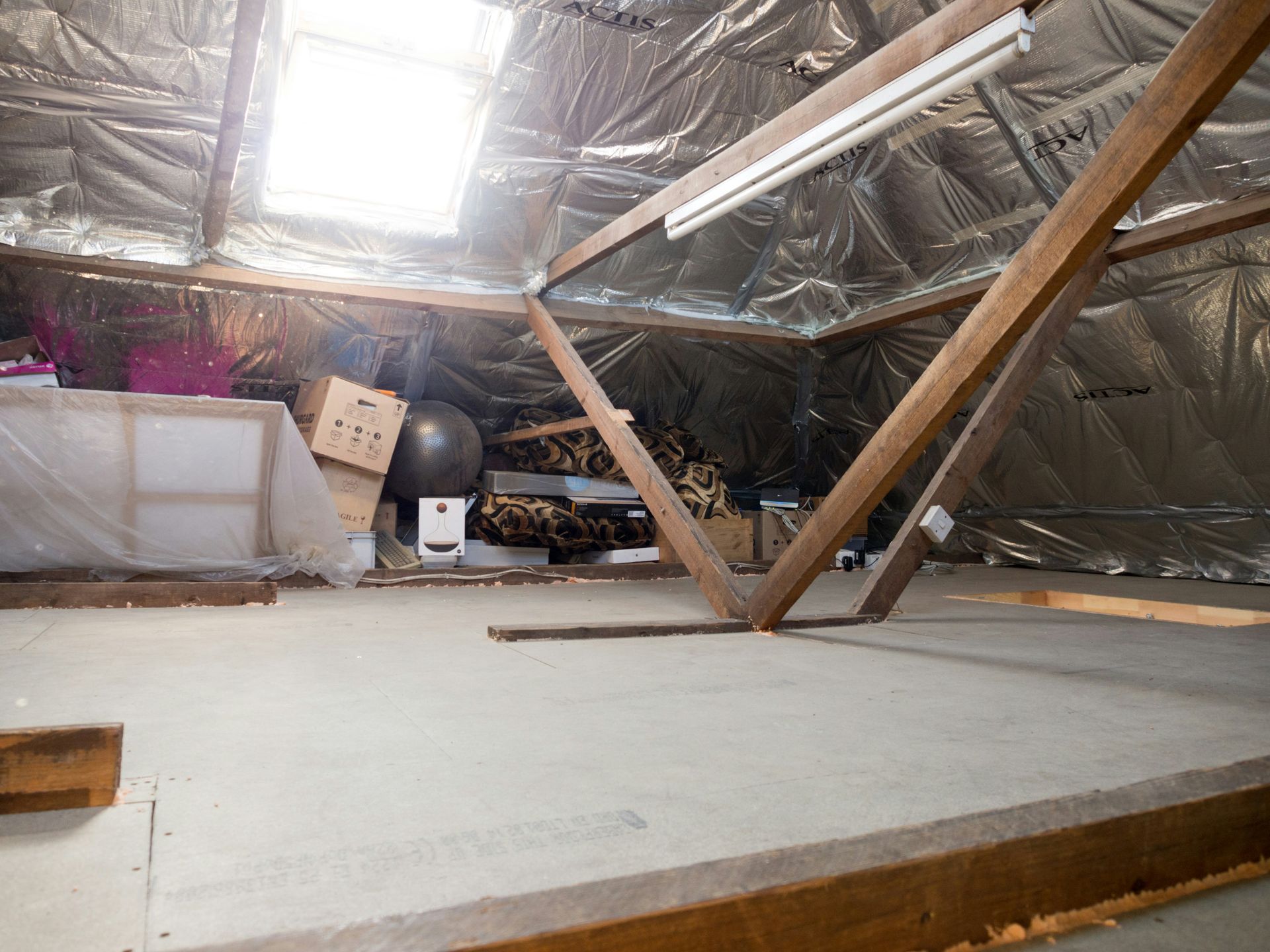 An attic with some stored items is pictured
